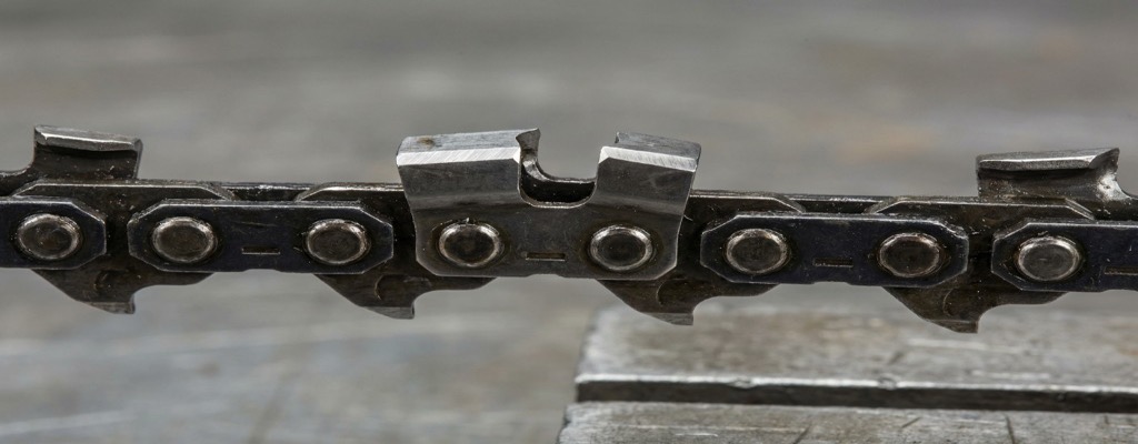 OEM and private label chainsaw chain manufacturing — close-up of professional chainsaw chain